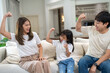© Art_Photo - Portrait of enjoy happy love asian family father and mother with little asian girl smiling and having protein breakfast drinking and hold glasses of milk at home