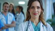 © Игорь Розводовский - image of confident female doctor in medical uniform.
