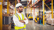 © OpticalDesign - Confident Saudi Arabian Warehouse Worker in Safety Vest and Hard Hat, Logistics and Distribution Center