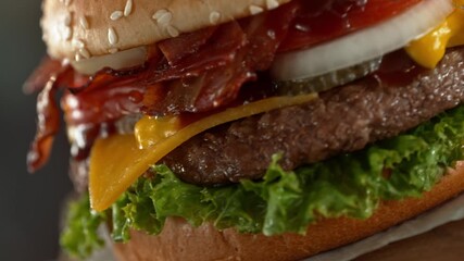 Wall Mural - Tasty Home Made Burger with Camera Movement and Rotating . Delicious Burger with Fresh Cabbage, Cheese, Onions, Bacon, Tomatoes and Grilled Beef Steak.