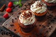 © Ben Kuang - Delicious chocolate cupcakes with creamy frosting and chocolate chips.