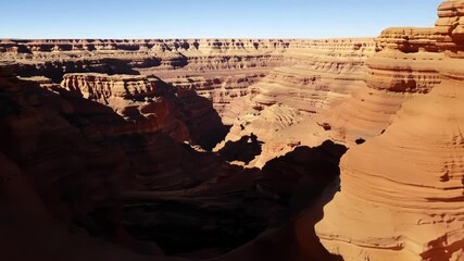 Poster - Flying between the deep crevices and canyons of the rocky desert cliffs.