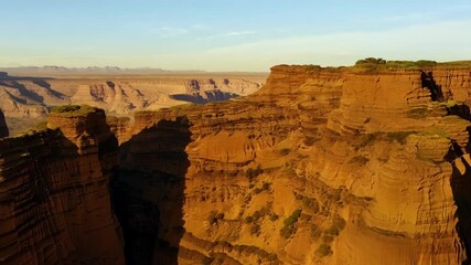 Poster - Soaring alongside the sharp jagged edges of the towering desert cliffs.