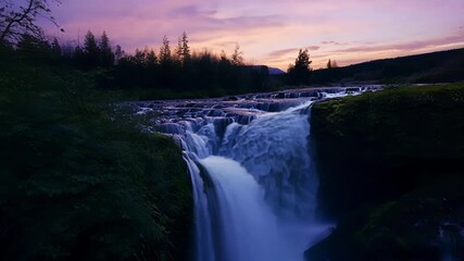 Sticker - Tiny waterfalls cascade down the rivers edge providing a soothing soundtrack to the twilight scene.