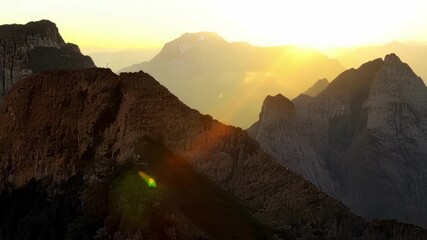 Poster - With the sunlight the once dormant mountains come to life revealing their intricate details and rugged textures.