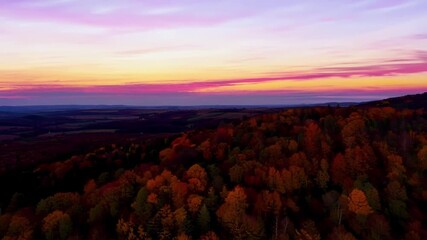 Poster - The vibrant colors of fall come to life in this stunning aerial footage of the twilight hills.