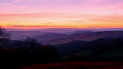Poster - As the sun sets the hills become a canvas of fiery reds oranges and yellows creating a stunning autumn sunset.