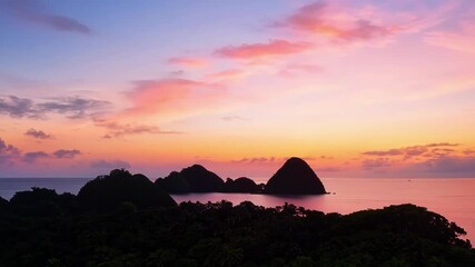 Poster - Observing the changing colors of the sky as the islands are bathed in soft hues of orange and pink signaling the end of another day.