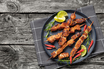 Canvas Print - roasted juicy pork kebabs on plate, top view