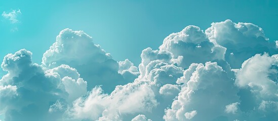 Wall Mural - Stunning clouds stand out against a soft blue sky in the copy space image.