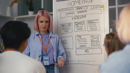 Young woman tutor reads a lecture about web design in IT school, explains task