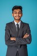 © LukaszDesign - Businessman in suit with arms crossed, satisfied and motivated on mockup studio background. India's male corporate worker and entrepreneur confident, smiling or goal