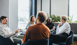 © Jacob Lund - Business professionals having a meeting in an office, discussing and brainstorming as a team