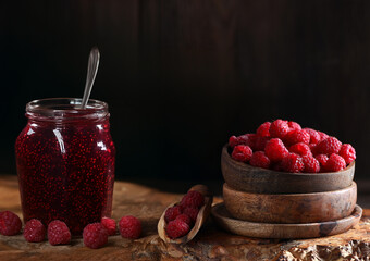 Poster - raspberry jam and fresh berries on wooden background