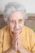 © berna_namoglu - portrait of a senior woman pray or meditate