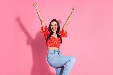 Sticker - Portrait photo of young hispanic brunette beautiful woman in red blouse raised fists up winner success isolated on pink color background