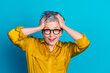 © deagreez - Photo of excited cheerful woman wear blouse spectacles arms head emtpy space isolated blue color background