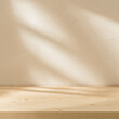 © mallmo - Empty table on white texture wall background. Square composition with abstract shadow on the wall. Mock up for presentation, branding products, cosmetics food or jewellery.