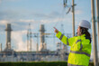 © reewungjunerr - Asian man petrochemical engineer working at oil and gas refinery plant industry factory,The people worker man engineer work control at power plant energy industry manufacturing