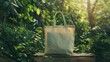 © Lull - Reusable bag in nature. An empty reusable shopping bag on a wood surface with a natural, green, leafy background.