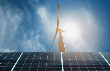 Wall Mural - wind turbine is seen against a blue sky