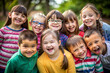 © Yekatseryna - Group of Multi-ethnic children looking at camera and posing together. Diverse different cool school students boys and girls wide angle. Concept diversity and inclusion