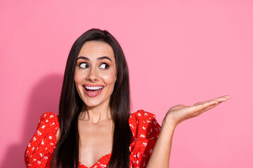 Poster - Photo of brunette charming young lady in red glamour vintage blouse holding arm product looking excited promo isolated on pink color background