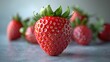 © ProVector - Single ripe strawberry is standing out from a group of strawberries over a gray background