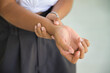 © 9nong - Hand closeup shot of young African woman suffering from CTS or carpal tunnel syndrome, trigger finger, gout disease, gouty wrist arthritis inflammation, wrist pain office syndrome