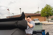 © Chance - man attempting to put on sunroof