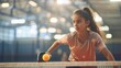 © AlfaSmart - Young girl playing pickleball in an indoor sports complex