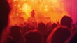 © Iswanto - Silhouetted crowd at a concert, bathed in warm stage lights.