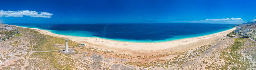 Wall Mural - white sandy beach and blue water in morro jable, south of fuerteventura, canary islands