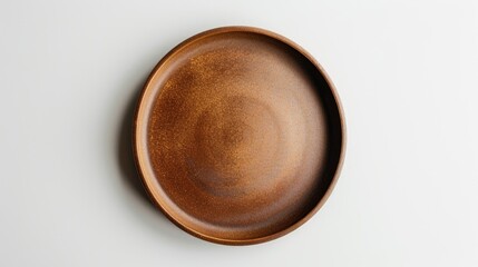 Brown plate on white background from above