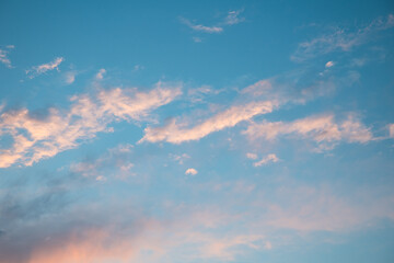 Magic pink cumulus clouds in blue sky, sunset, sunrise, nature background, wallpaper