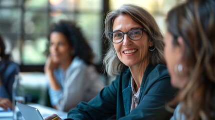 Wall Mural - A woman in a suit is smiling at the camera