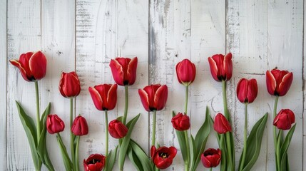 Poster - Tulip flowers display on a light wooden backdrop