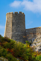 Sticker - Majestic Golubac fortress atop rocky cliffs by Danube river in Serbia on a clear day