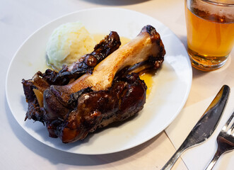 Sticker - Close up of delicious baked pork knuckle with mashed potatoes, served on plate