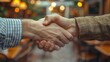 © SHI - phone photo of lawyer shaking hands with clients, in a cozy office