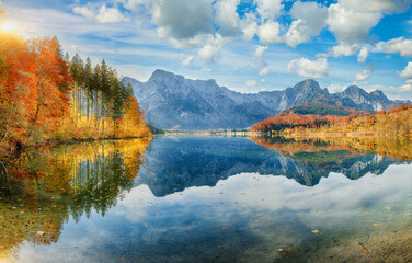 Wall Mural - breathtaking autumn scene of sunny morning on almsee lake.