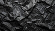 © CreativeCreations - Crumpled black cardboard with wrinkles and wrinkled folds. Old wrapping dusty paper