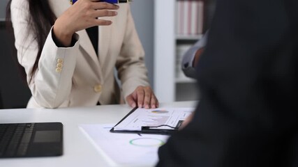 Wall Mural - Businessman meeting with colleagues, discussing the sales situation and making a marketing plan. Brainstorming, discussing financial analysis and planning business strategies.