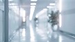 © Maria - A blurred hallway in a healthcare facility features modern lighting and calming colors, creating a serene atmosphere for patients