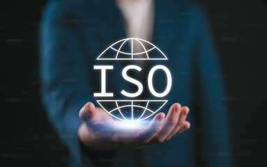 Aufkleber - ISO Standards Quality Control Assurance. Businessman holds glowing ISO symbol, representing international quality control, assurance, and business technology standards. ISO standard certification, QC,