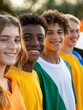 © wpw - A group of diverse teenagers smiling and holding flags of their heritage countries, showcasing international friendship and unity.