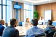 © Rysak - Business People Sitting at Conference Table in Meeting