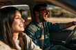 © La Famiglia - Young couple enjoying the freedom on a Car Trip over a country offroad