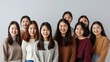 © Luxetify - Group of Smiling Asian Women in Sweaters
