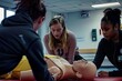 © Umar - Three students in a first aid training class.